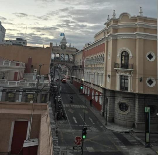 a city street with a green traffic light and buildings at Hotel la Ermita in Las Victorias