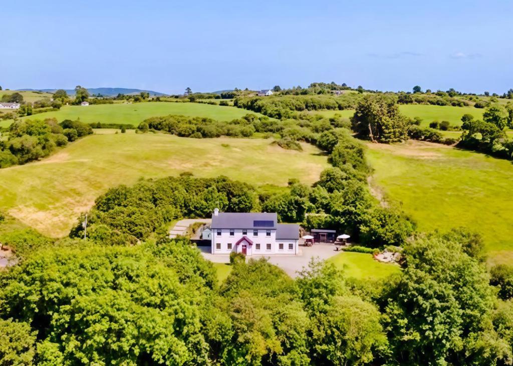 an aerial view of a large house in a field at Riverside Garden B and B in Bishops Village