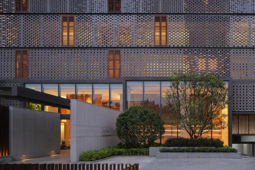 an external view of a building with lights on it at The Lantern in Shunde