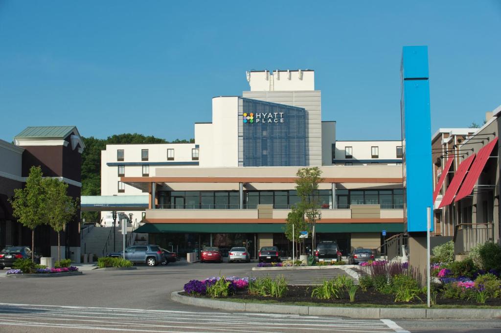 a parking lot in front of a large building at Hyatt Place Boston/Braintree in Braintree