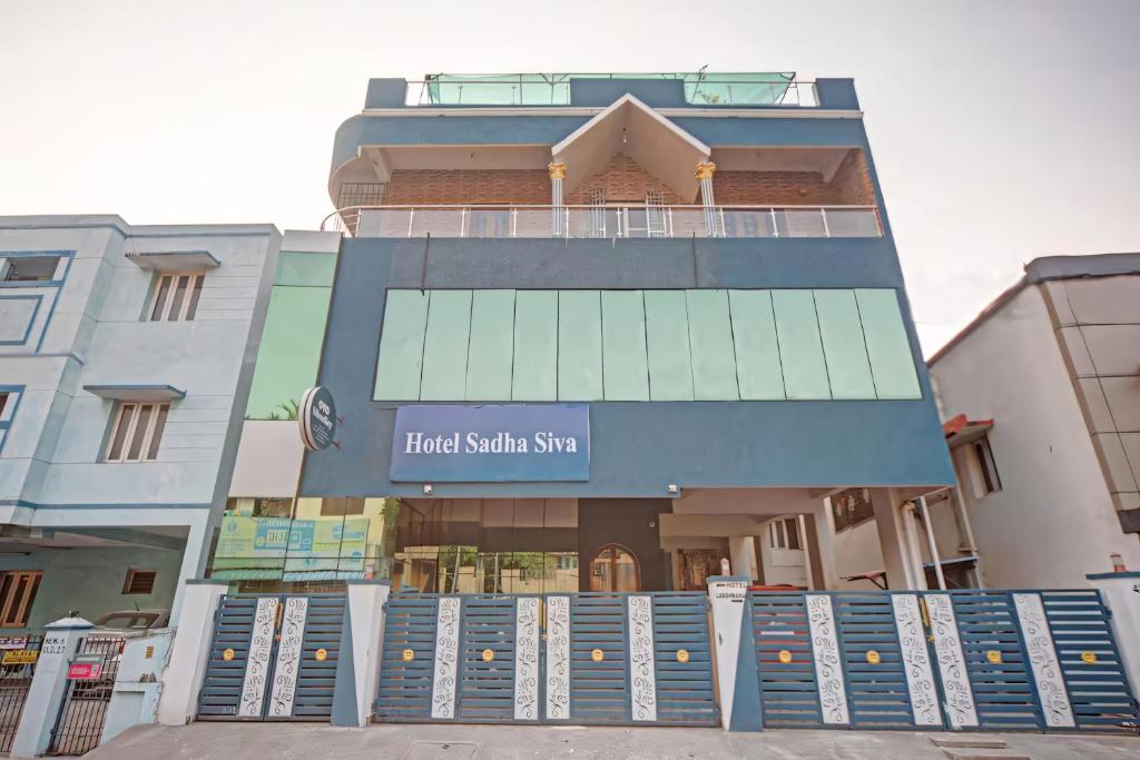 a building with a sign that reads black santa shine at Open Hotel by Olive - Sadha Siva Airport Road, Chennai in Chennai