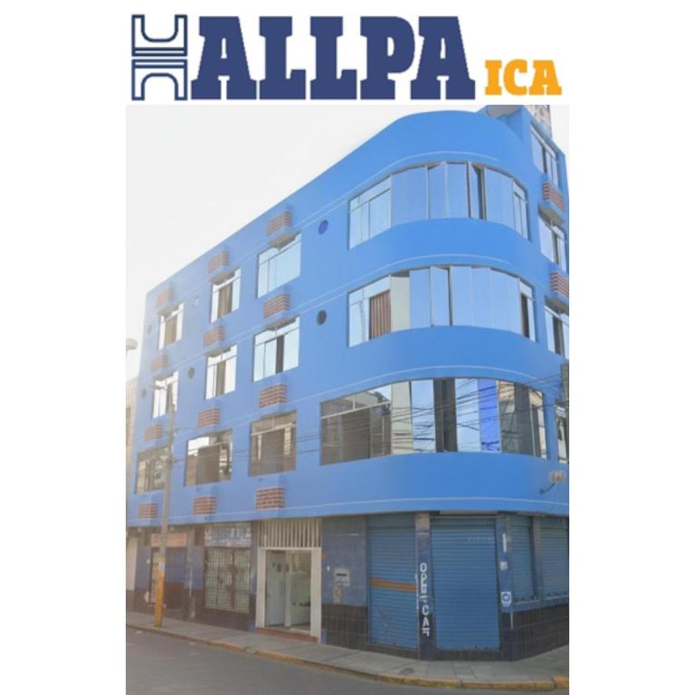 a blue building with the words alpaca on the side of it at Hallpa Ica in Ica