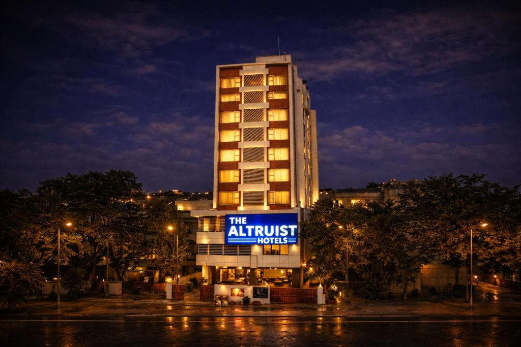 a hotel building with a sign that reads the airtrust house at The Altruist Andheri Hotel in Mumbai