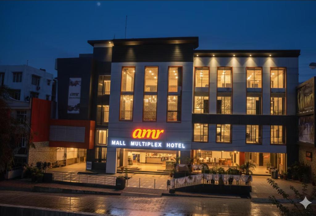 a building with a sign on the front of it at The Altruist Katra Hotel in Katra