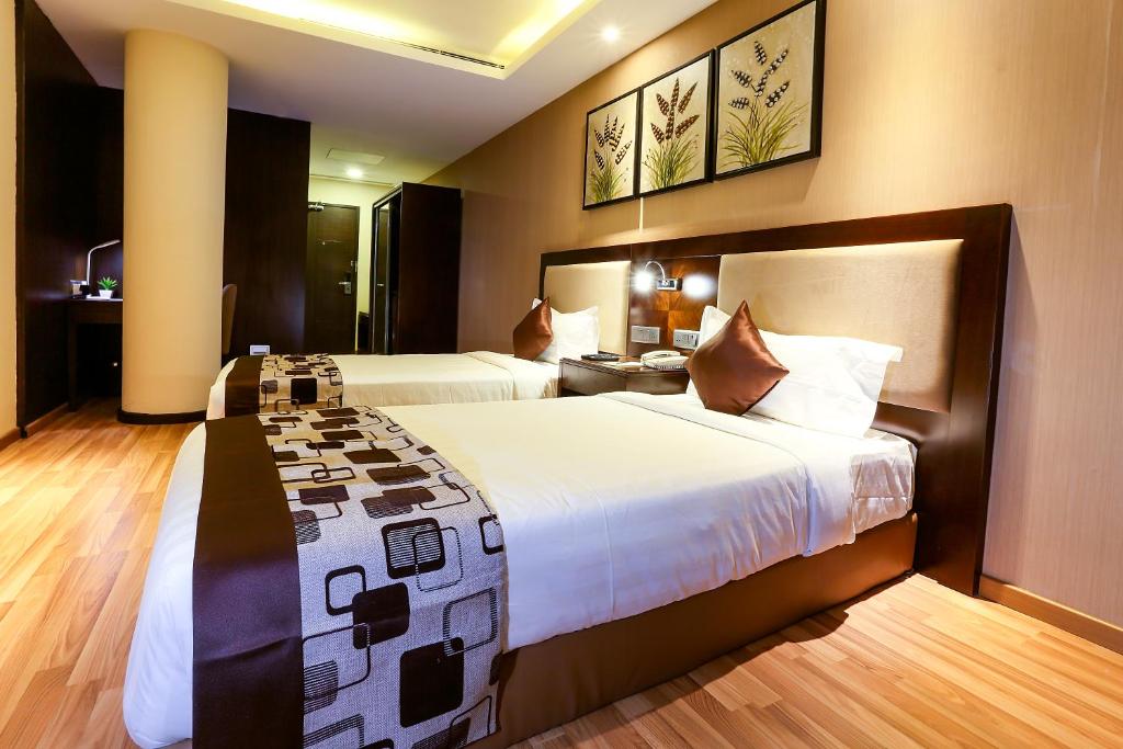 Postel nebo postele na pokoji v ubytování Delta Suites - The Soothing Luxury