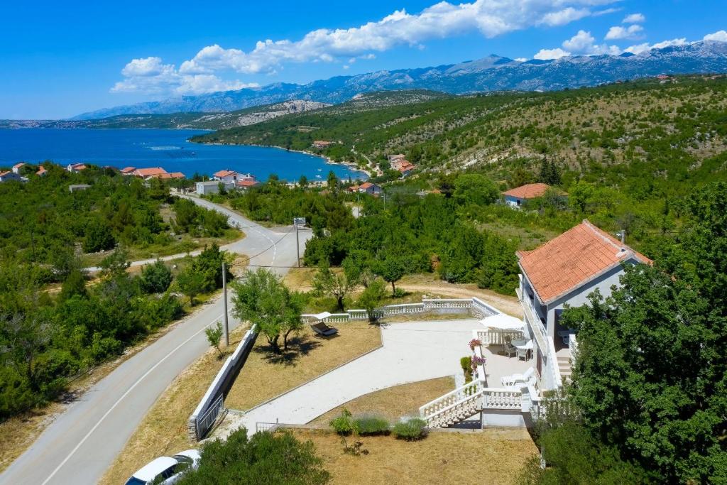 an aerial view of a house with a lake at Antonija in Bašić
