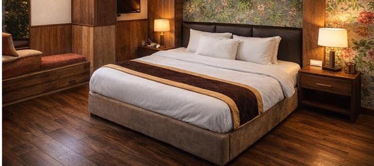 a bedroom with a large bed in a room at rashik stayzz in Shimla