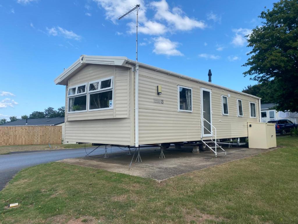 a mobile home is parked on the side of a road at Static home sleeps 6 in Dawlish Warren