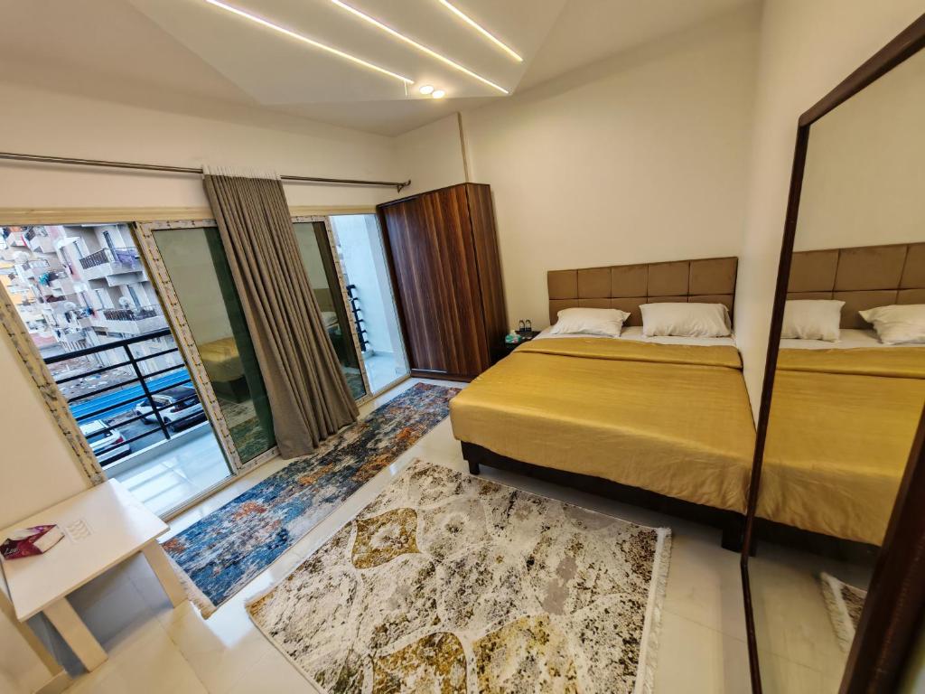 a hotel room with two beds and a window at Red Sea Downtown in Hurghada