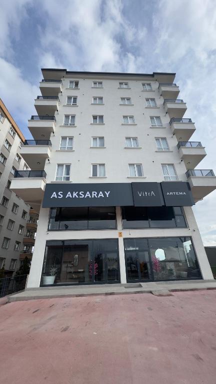 a large white building with an asasarasy sign on it at Köşk Rezidans Apart in Aksaray