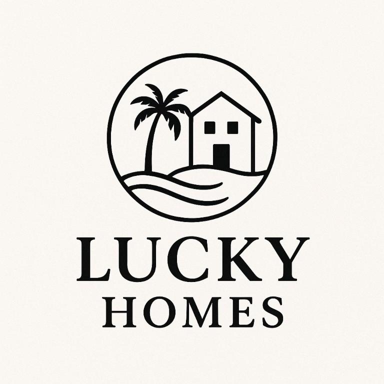 a house and palm trees in a circle logo at Lucky Homes in Srīvardhan