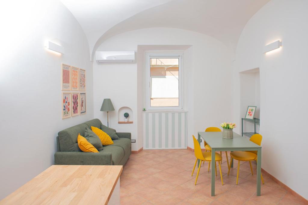 a living room with a couch and a table at Manzi 40 in Civitavecchia