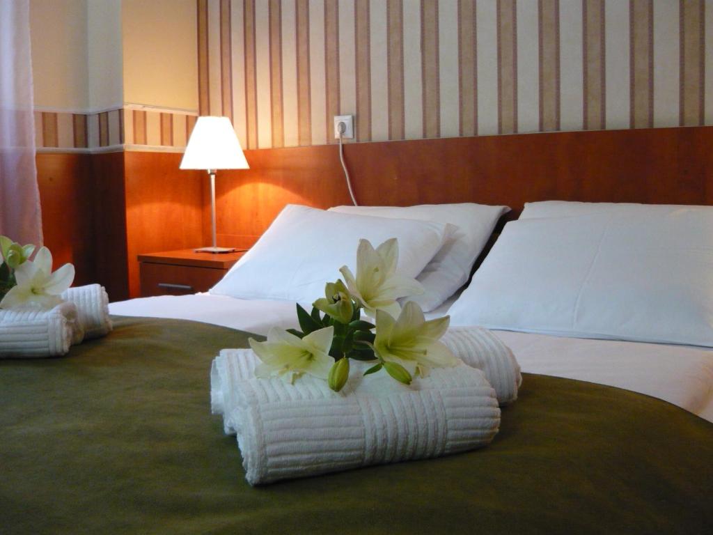 Postel nebo postele na pokoji v ubytování Atlantic Hotel
