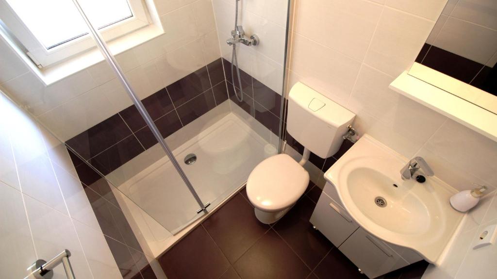 Koupelna v ubytování Apartments Gajo