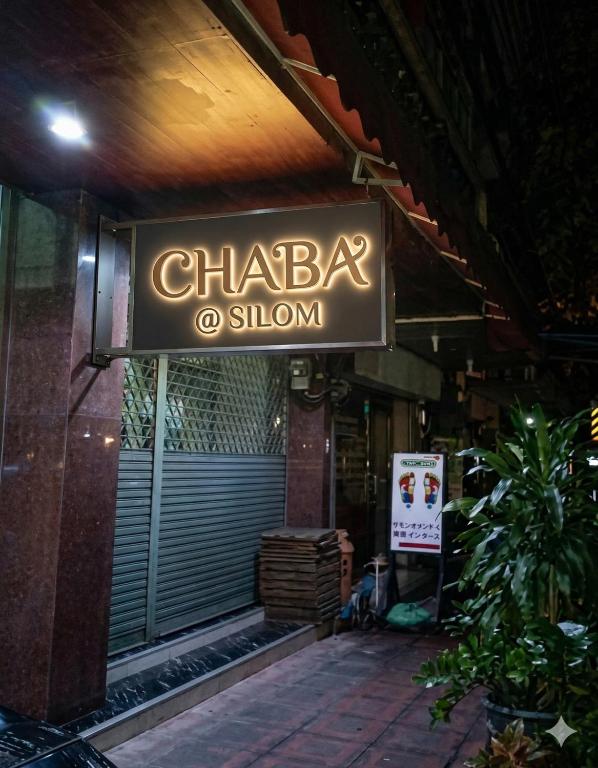 a sign for a chakra show on a building at Chaba silom in Bang Rak
