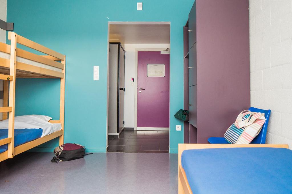 Postel nebo postele na pokoji v ubytování Hostel De Veurs