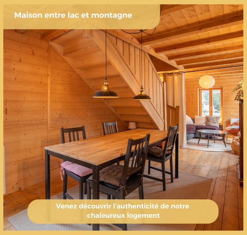 a dining room with a wooden table and chairs at Maison Méserier I T3 I Publier in Publier