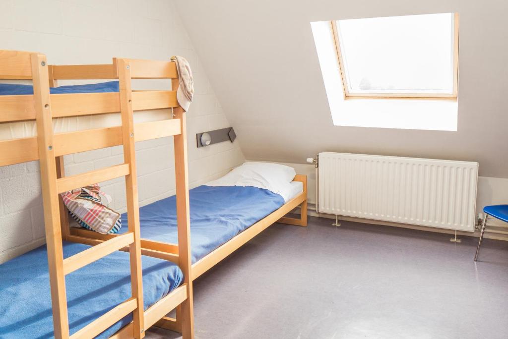 Postel nebo postele na pokoji v ubytování Hostel De Veurs