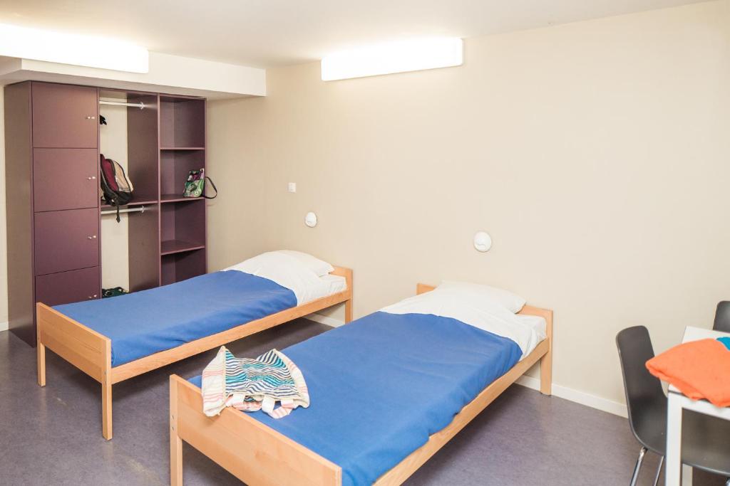 Postel nebo postele na pokoji v ubytování Hostel De Veurs