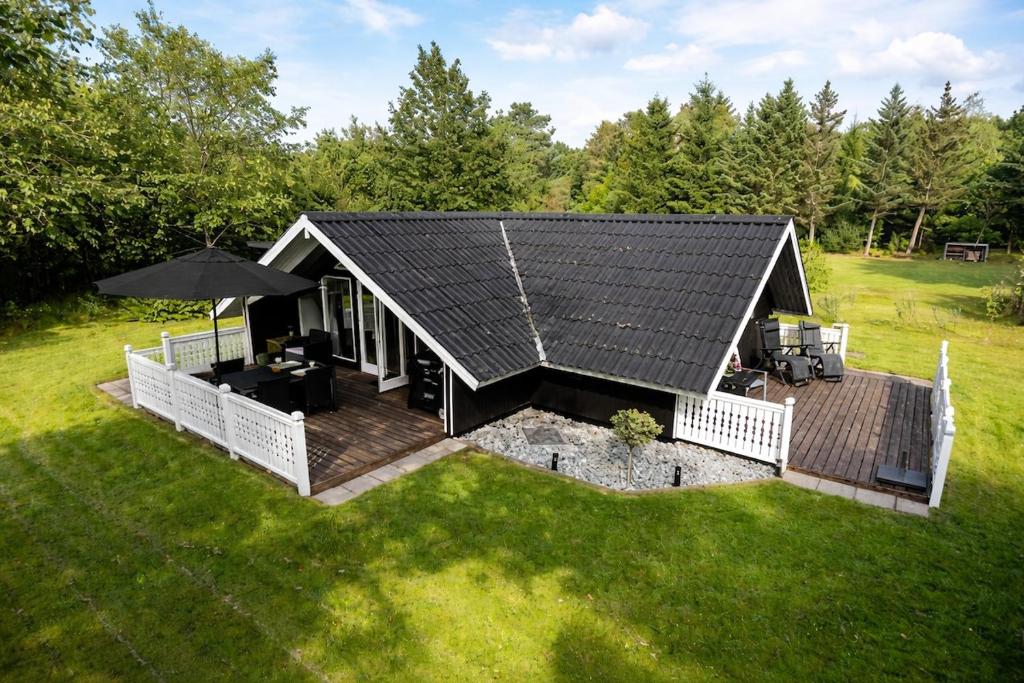 an overhead view of a house with a deck at Glamping Cabin Wilderness bathing and relaxation in Silkeborg