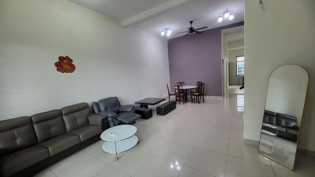 a living room with a couch and a table at Alpha 2 in Johor Bahru