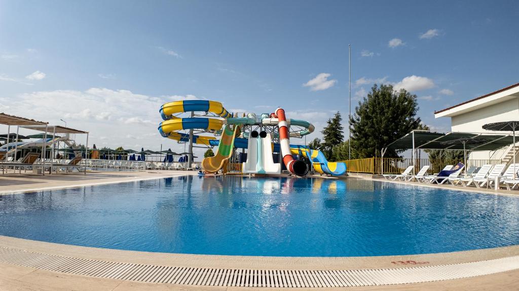 a swimming pool with a water park with a water slide at Burgaz Resort Aquapark Hotel in Kırklareli