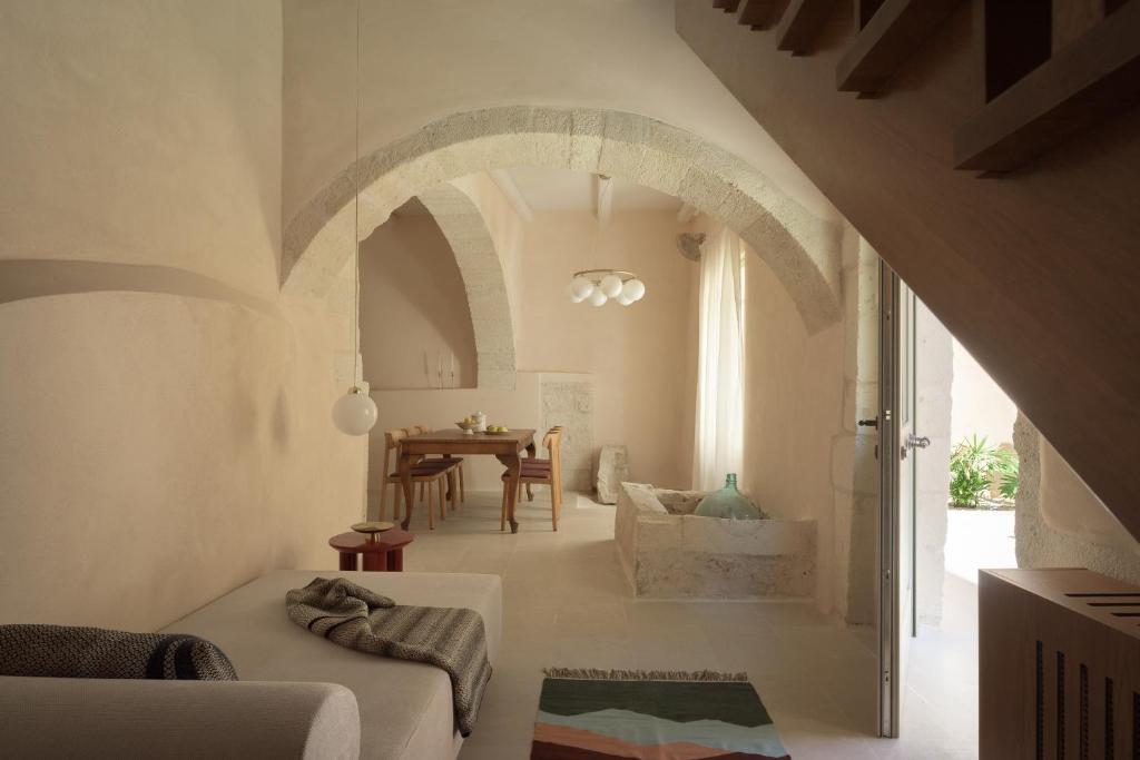 a living room with a couch and a table at Moshoviti Residence in Rethymno