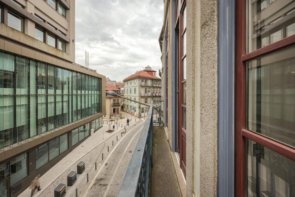 a view of a city street from a building at Aliados Town Hall Central Apt by LuxiStay in Porto