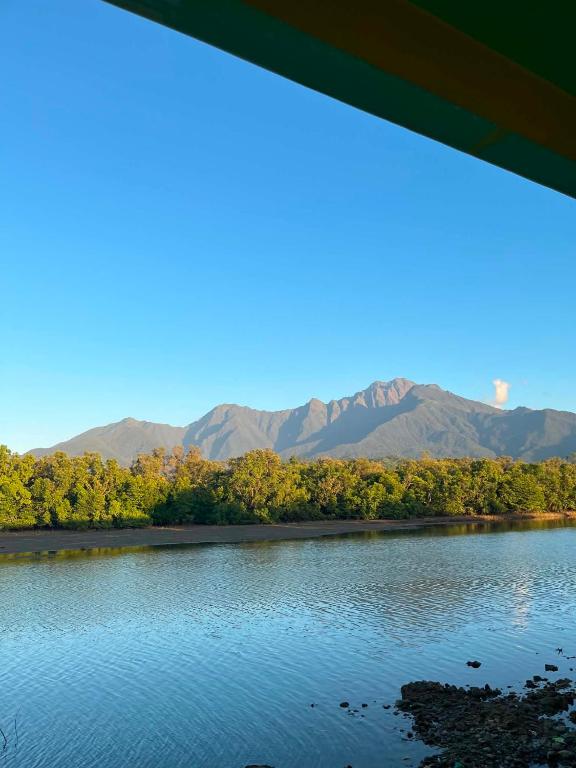 a view of a river with mountains in the background at Magdiwang Nature's View Lodge in Magdiwang