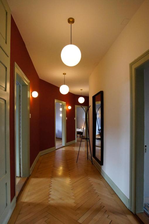 an empty hallway with a mirror and a tripod at ReLiving - Historic City Apartment in Lucerne