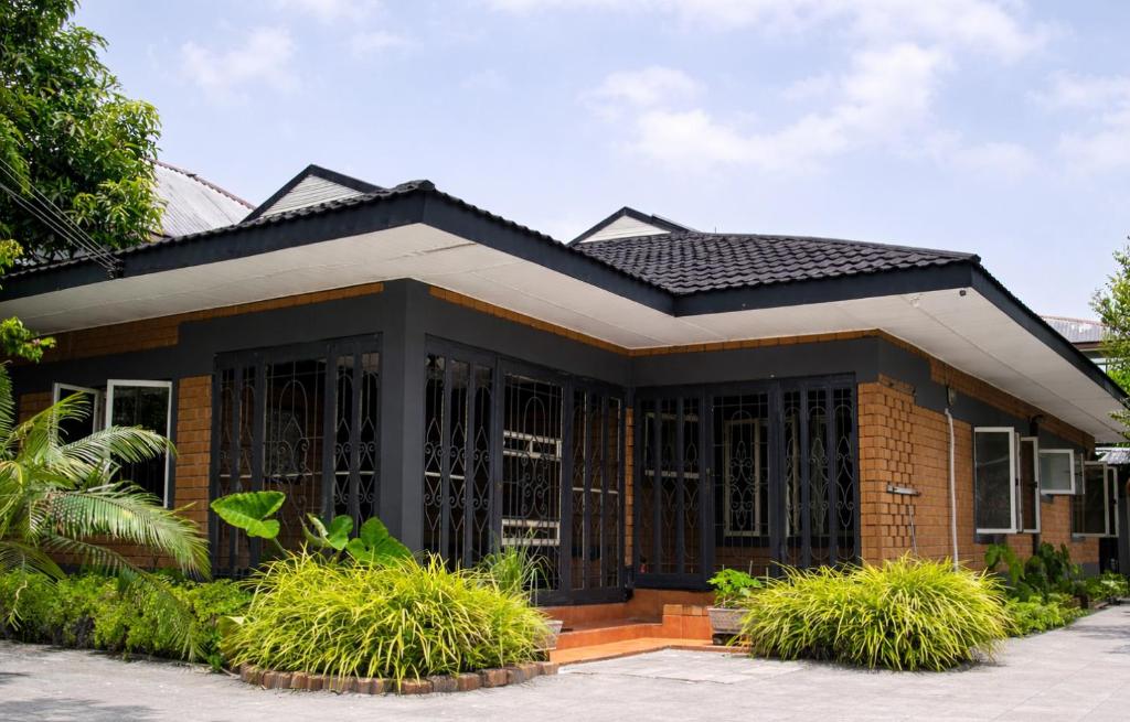 a small house with a black roof at Fern Haven in Port Harcourt