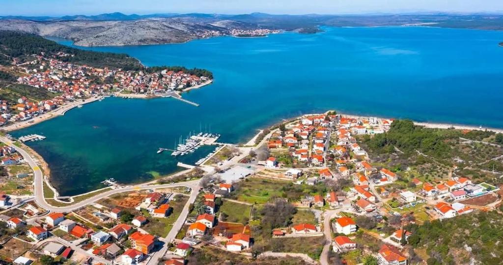 an aerial view of a town next to the water at Apartman Cvita in Bilice