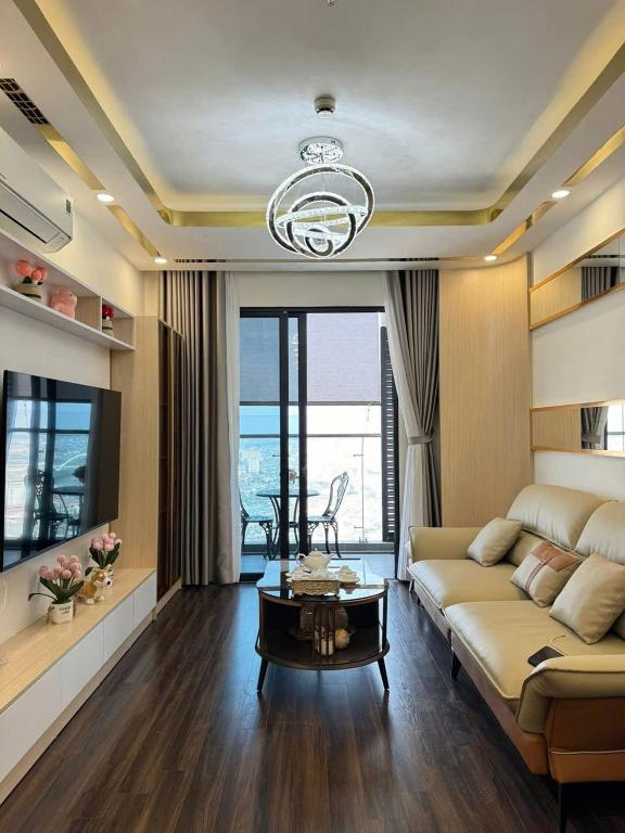 a living room with a couch and a table at Chill House in Hai Phong