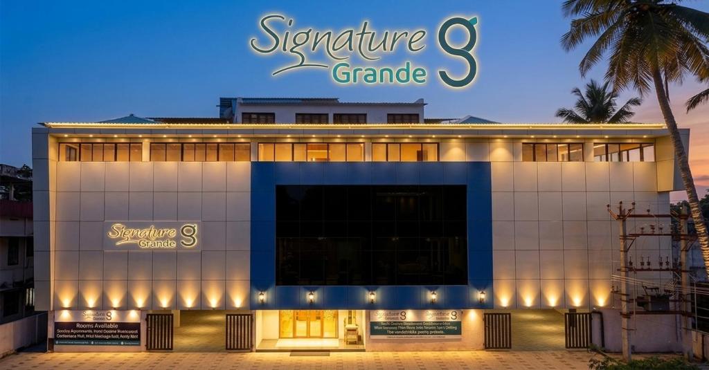 a building with a sign that reads signature grand at Signature Grande with swimming pool pondicherry in Pondicherry