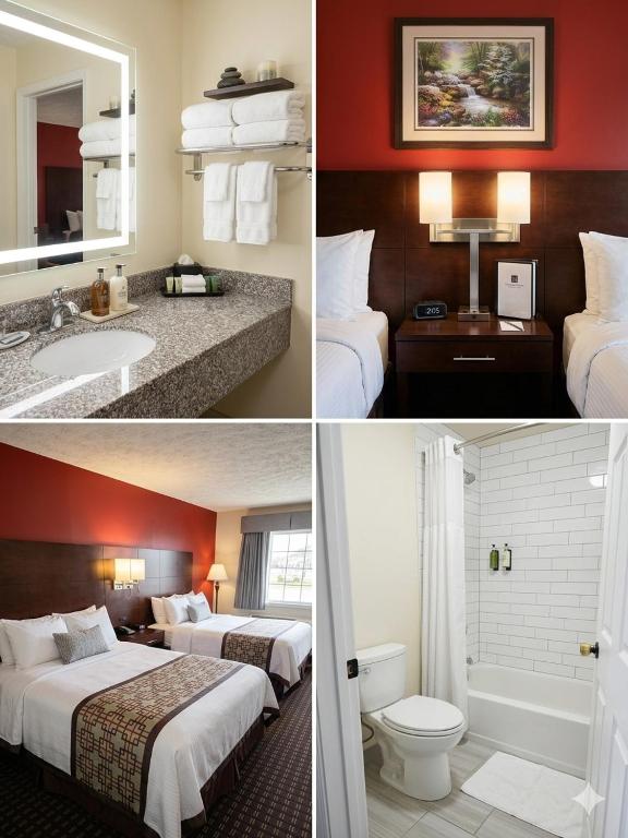 a hotel room with two beds and a bathroom at Surry Inn - Dobson - I-77 - Exit 93 in Dobson