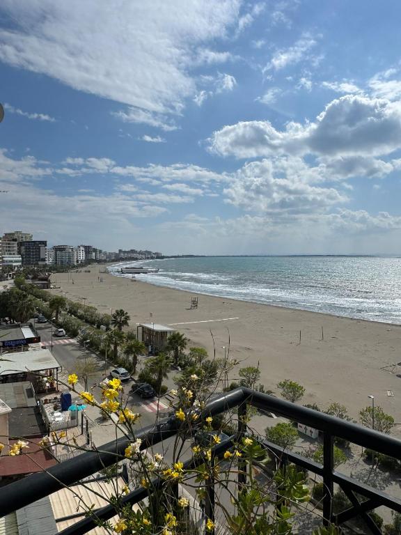 a view of the beach from the balcony of a condo at Hotel Brilant in Shëngjin