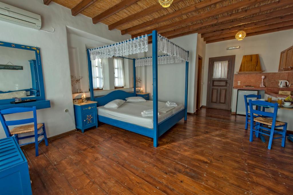 Postel nebo postele na pokoji v ubytování Anemos Studios