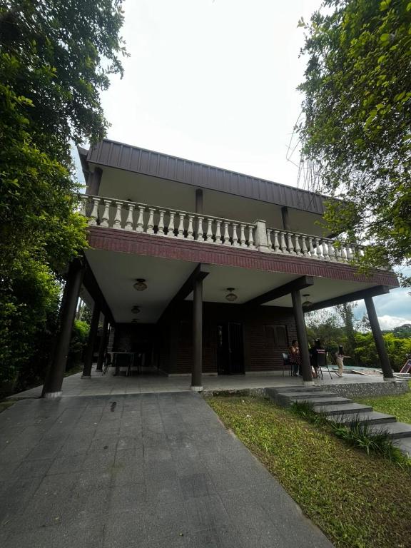 a large building with a balcony on top of it at casa cusi in Tafí Viejo