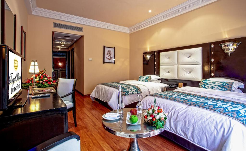 Postel nebo postele na pokoji v ubytování Royal Mirage Deluxe