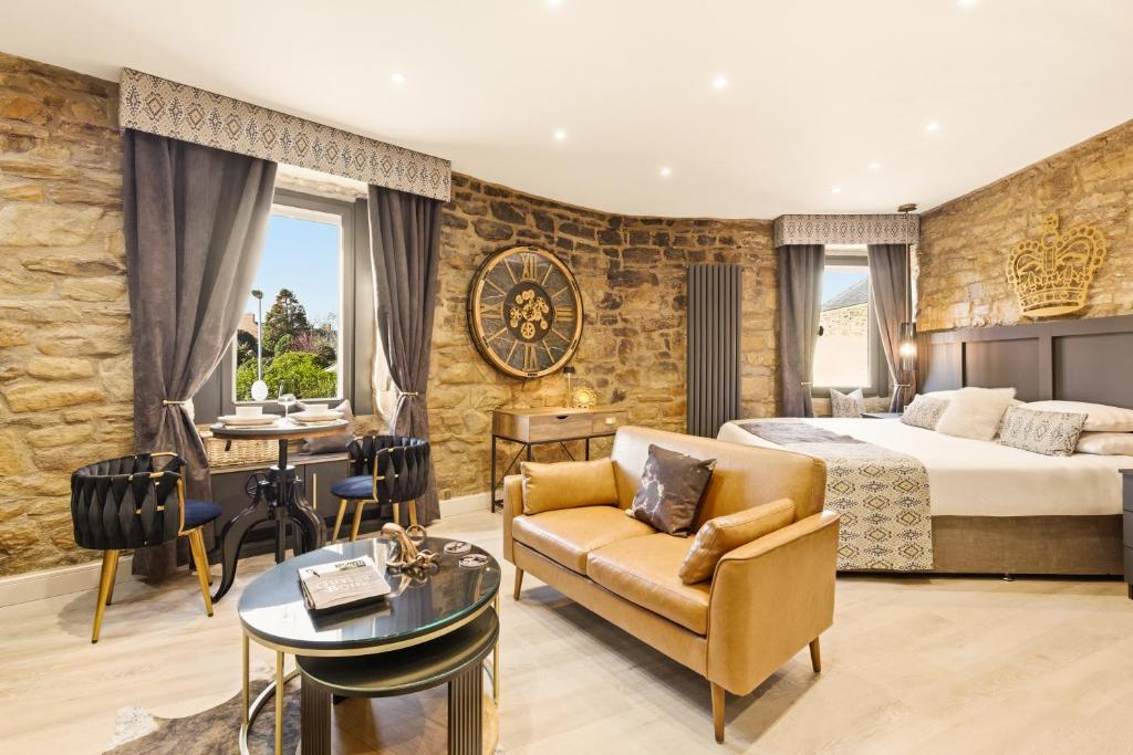 a hotel room with a bed and a desk at Just us Two - North East Escapes in Amble