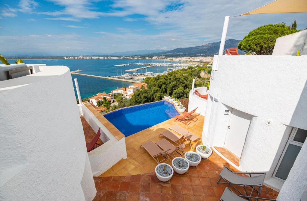 a view from the balcony of a house with a swimming pool at Agi Castell Mar in Roses