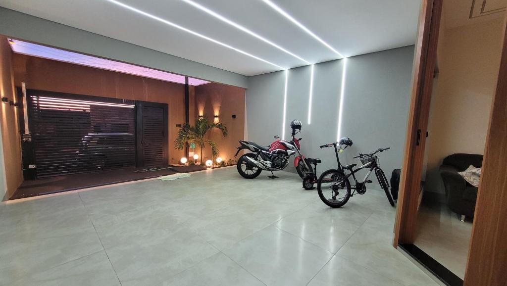 two motorcycles parked in a room with a lobby at Casa Tecnoshow 2026 in Rio Verde
