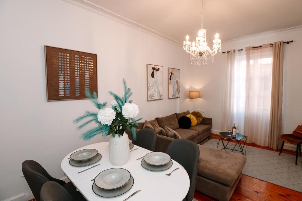 a living room with a table and a couch at Dolce Casa in Corfu