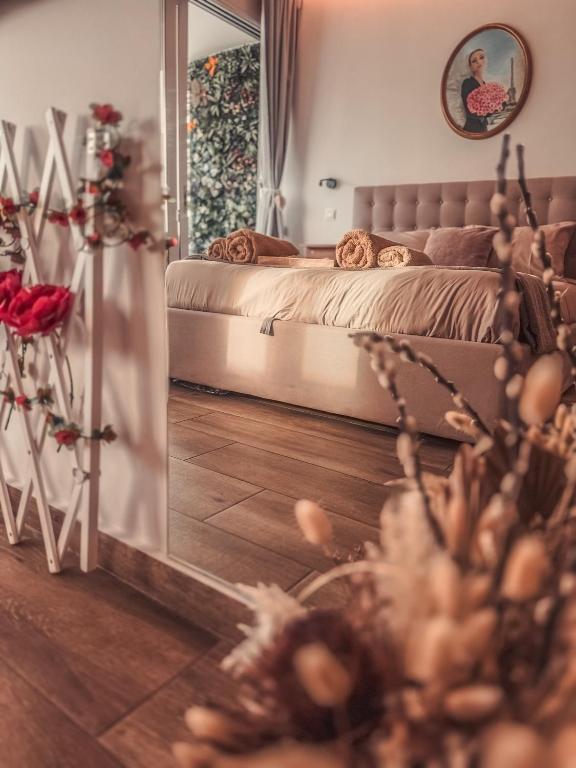 a bedroom with a bed and a mirror at Bohemian Rhapsody in Paphos