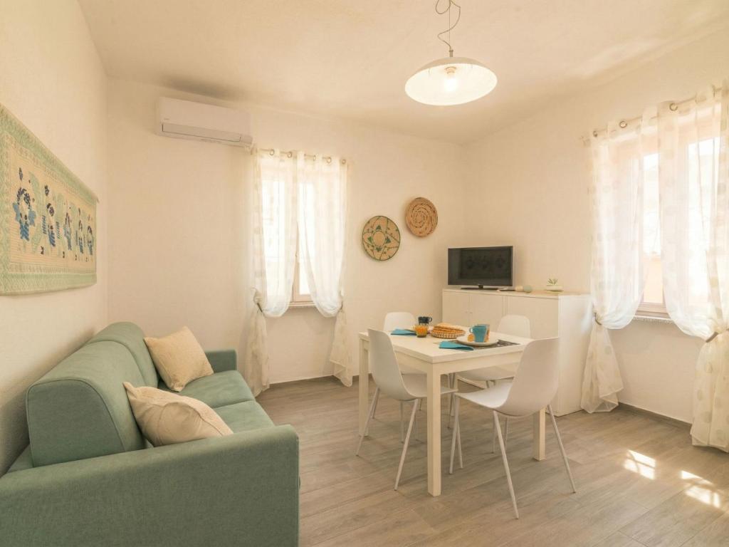a living room with a couch and a table at Apartment Nautilus by Interhome in Arzachena