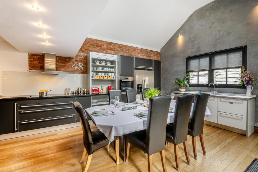 a kitchen and dining room with a table and chairs at 4 Bed in Helmsley oc-y039 in Helmsley