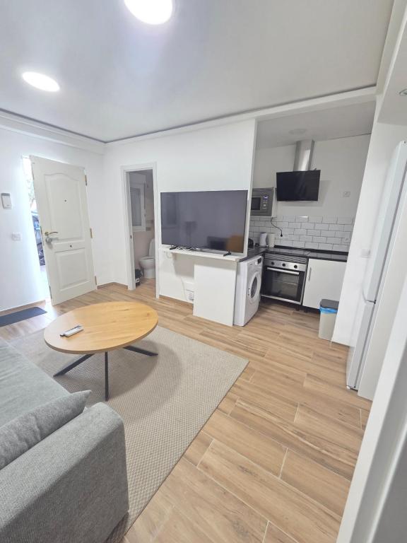 a living room with a couch and a table at Las vegas in Alcorcón