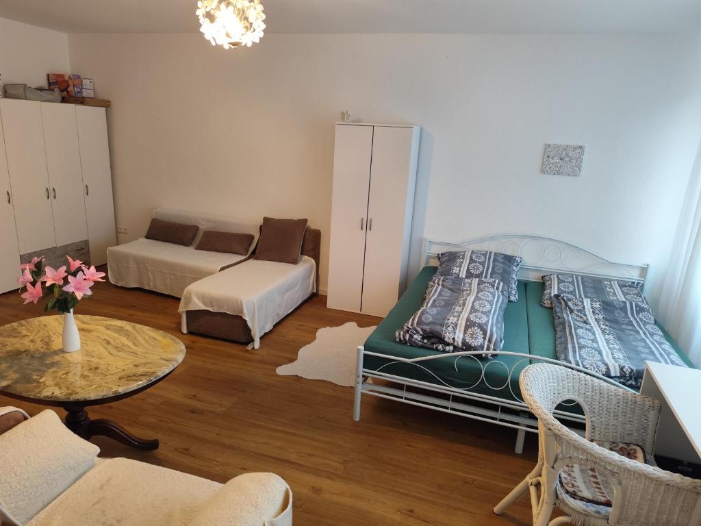a living room with a couch and a table at Appartement in Hannover