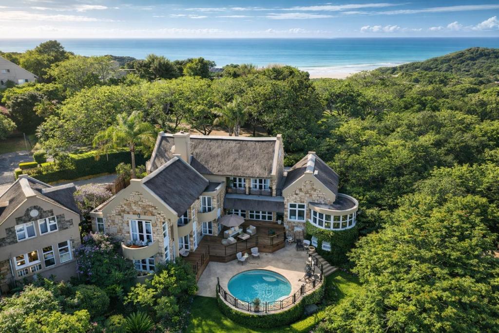 an aerial view of a house with a swimming pool at The Gables Boutique Hotel in Chintsa