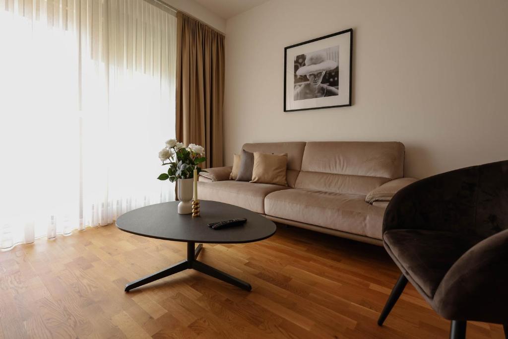 a living room with a couch and a table at Adria Gold - Bayview - Luxury in Kotor